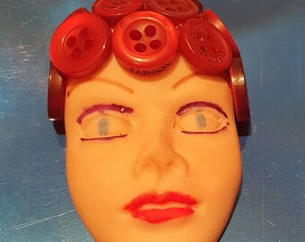 Large Lady face brooch with red button hat