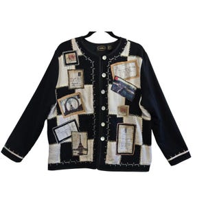 May include: A black and white long-sleeve cardigan featuring a checkered pattern with various rectangular patches depicting travel-themed imagery, including the Eiffel Tower and London Eye, secured with a vertical row of white buttons down the front.