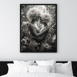May include: Black and white framed art print featuring two figures intertwined, adorned with floral headdresses and bodies. The artwork is set amidst a backdrop of flowers and foliage, creating a serene and artistic composition. The print is displayed above a bed.
