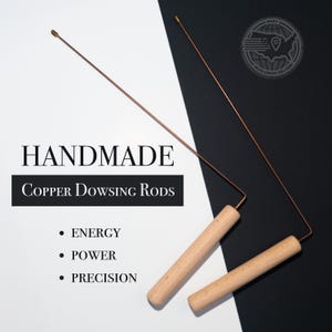 May include: A pair of handmade copper dowsing rods with wooden handles. The rods are on a white and black background. The text "HANDMADE COPPER DOWSING RODS" is at the top of the image. Below the text are three bullet points: "ENERGY", "POWER", and "PRECISION".