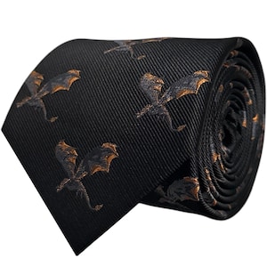 May include: Black necktie with a repeating pattern of gold dragons.