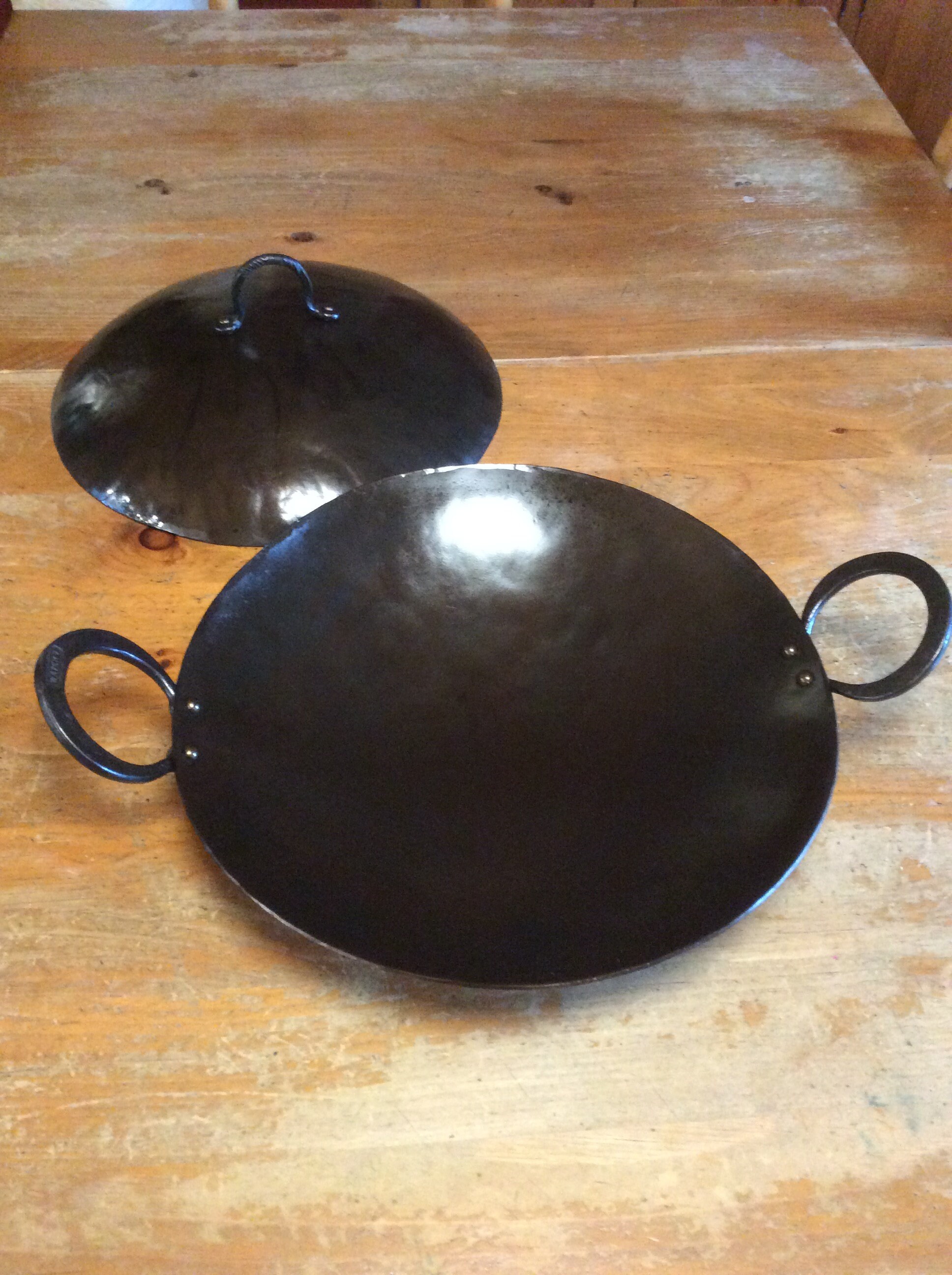 12 inch roaster with lid and double loop handles.