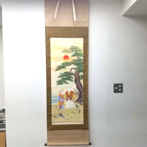May include: A Japanese scroll painting showing a landscape with figures under a tree, a setting sun, and birds. The artwork uses vibrant colours and detailed brushstrokes, showcasing a classic aesthetic.