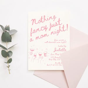 May include: Pink invitation card with the text "Nothing fancy just a mom night!" and a graphic of hands holding wine glasses. The invitation is for a well-deserved mom night hosted by Juliette on June May 1st at 123 Anywhere, Any City, State. RSVP by 5/1 at 123-456-