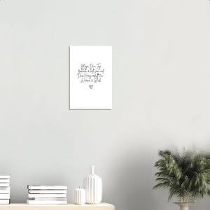 May include: A white card with black handwritten text that reads "Maya Dear Tag,  probably a bit late and definitely off-key, but here is a gift". A small heart is drawn at the bottom of the card.