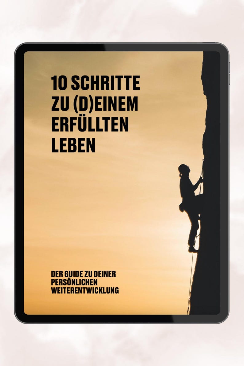 May include: A digital tablet screen displaying a motivational poster with the text "10 Schritte zu (D)einem erf&uuml;llten Leben" and "Der Guide zu deiner pers&ouml;nlichen Weiterentwicklung". The poster features a silhouette of a person rock climbing.