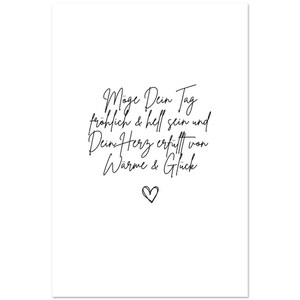 May include: Black and white printable wall art with a handwritten quote in German that reads "May your day be happy and bright and your heart filled with warmth and happiness". A small heart is at the bottom of the quote.