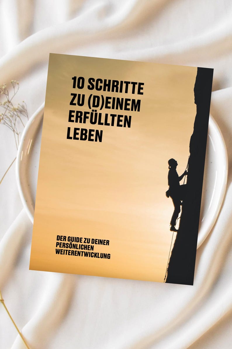 May include: A motivational poster with a silhouette of a person rock climbing a cliff. The poster has a sunset background and the text "10 SCHRITTE ZU (D)EINEM ERF&Uuml;LLTEN LEBEN DER GUIDE ZU DEINER PERS&Ouml;NLICHEN WEITERENTWICKLUNG".