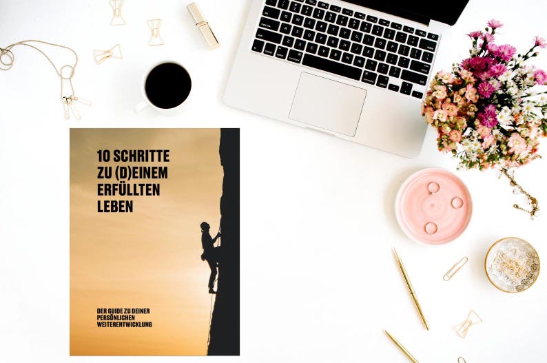 May include: A book cover with a silhouette of a person rock climbing on a cliff. The title of the book is "10 Schritte zu (D)einem Erf&uuml;llten Leben" and the subtitle is "Der Guide zu deiner Pers&ouml;nlichen Weiterentwicklung".