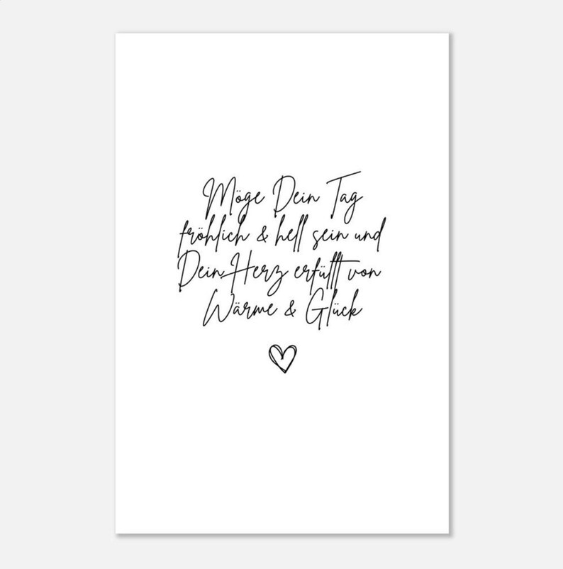 May include: A white card with black calligraphy that reads "May your day be happy and bright and your heart filled with warmth and happiness". A small black heart is at the bottom of the card.