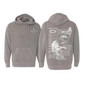 May include: Gray hoodie with a front pocket and a hood. The front features a small graphic of a cross. The back displays a detailed illustration with the text "FORGIVE THEM FATHER" and religious imagery.