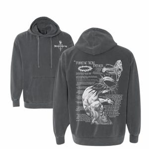 May include: Dark gray hoodie with a front pocket and a hood. The front features a white cross design. The back displays a detailed graphic with text, a crown of thorns, and a depiction of a figure with a cross.