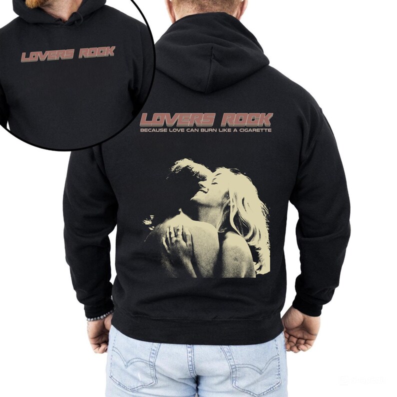 May include: Black hooded sweatshirt with a graphic print of a couple embracing. The text "LOVERS ROCK" is printed in a retro style font with the tagline "Because love can burn like a cigarette".