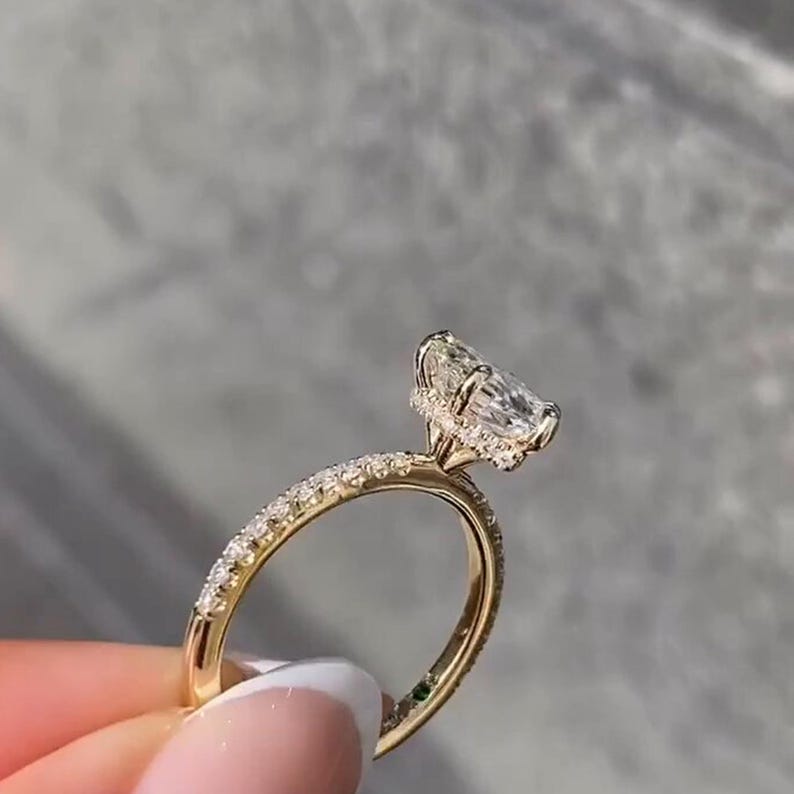 Stunning 2 carat hexagon cut lab grown diamond ring with a hidden halo, handcrafted in solid 14K gold. Modern and ethical engagement ring featuring a moissanite wedding band for added sparkle. Ideal for proposals, anniversaries, or as a unique promise ring. Sleek, geometric design for the contemporary bride. Sustainable and luxurious fine jewelry gift for her, available in rose, white, or yellow gold.