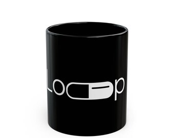 Taza con gráfico de máscara de bucle / Taza de café de cerámica negra