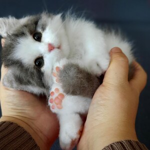 Realistic toy fluffy kitten replica