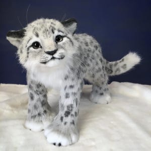Realistic handmade snow leopard toys. fur toys