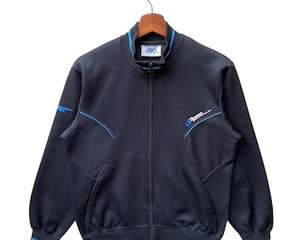 Chaqueta deportiva Asics vintage de los años 90, fabricada en Japón, color negro y azul, talla S.