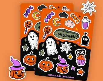 May include: Two orange Halloween-themed sticker sheets with various illustrations. The stickers include pumpkins, ghosts, candy, a spider web, and the word "Halloween". A pumpkin sticker with a witch hat is also visible.