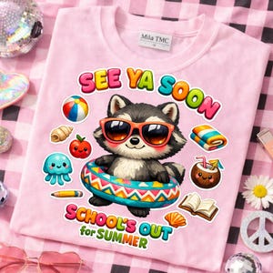 May include: Pink t-shirt with a graphic of a raccoon wearing sunglasses and a swim ring. The shirt has the text "SEE YA SOON" and "SCHOOL'S OUT for SUMMER". Additional graphics include a beach ball, apple, and a coconut drink.