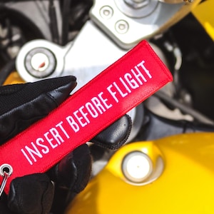 Insert Before Flight Embroidered Motorcycle Keychain by Mototags_