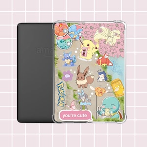 May include: A clear protective case for an e-reader featuring colorful cartoon images of Pokémon characters. The case has a pink background with the text "you're cute" in a pink speech bubble. The e-reader is black.