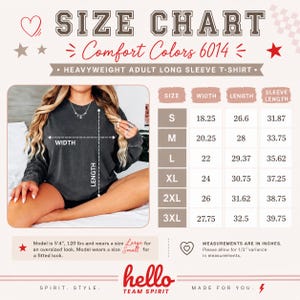 May include: Size chart for a Comfort Colors 6014 heavyweight adult long sleeve t-shirt. The chart includes measurements in inches for sizes S through 3XL. The image also includes the text "hello TEAM SPIRIT".