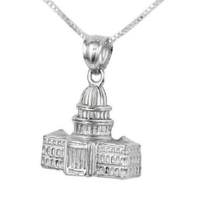 May include: A silver necklace with a pendant shaped like the US Capitol building.