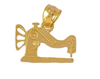 May include: Gold-toned metal charm in the shape of a sewing machine. The charm has a detailed design with a needle, foot pedal, and a decorative spool.