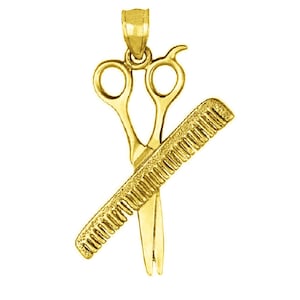 May include: Gold-toned pendant charm featuring a pair of scissors and a comb, a symbol of the hairdressing profession.