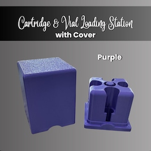May include: A purple Cartridge & Vial Loading Station with Cover. The set includes a solid rectangular cover with a textured top and a base unit featuring four circular cutouts and a central post for holding vials and cartridges securely.