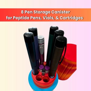 May include: A cylindrical storage canister with a red and orange gradient finish, designed to hold eight items. It contains several medical-style pens and small vials. The text 8 Pen Storage Canister for Peptide Pens, Vials, & Cartridges is visible.