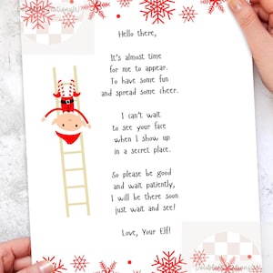 May include: A white sheet of paper with red snowflake patterns and text. The text says "Hello there, It's almost time for me to appear. To have some fun and spread some cheer." An illustration of an elf on a ladder is also present.
