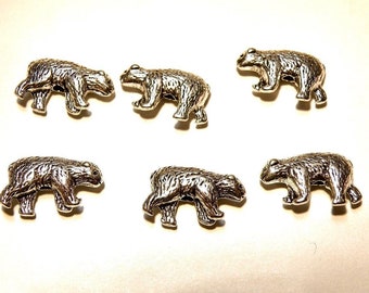 May include: Six silver bear charms, each with a detailed design, perfect for jewelry making or crafting projects.