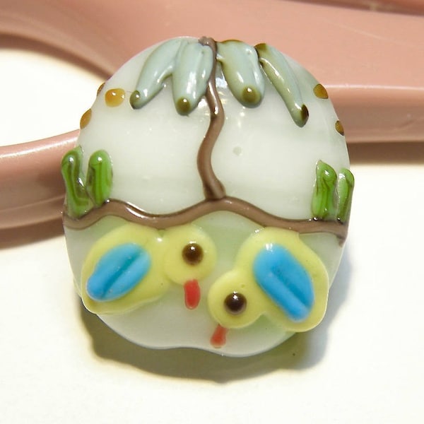 One (1) Off-White Puffy Oval Lampwork Focal Bead with Yellow Birds and Tree Design - Lot UU