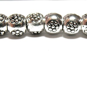 12 Pewter Silver Spacer Bead Rings with Flower Design