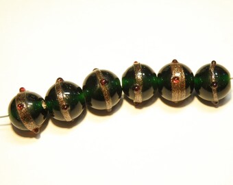 Six (6) Dark Green Round Translucent Beads with Goldstone Band and Dark Red Bumps