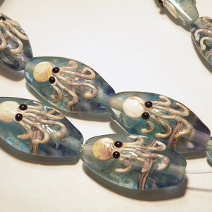 Two (2) Pale Capri Blue and Purple Oval Lampwork Glass Bead with Shades of Tan Brown Octopus Design - Lot UU
