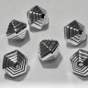 May include: Six silver metal beads with a hexagonal shape and a pyramid-like design. The beads have a hole in the center for stringing.