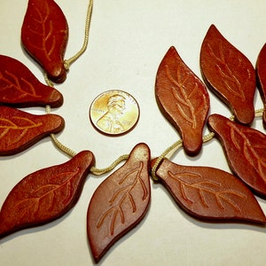 One (1) Large Embossed Leaf Shaped Leather Bead Pendant --- Lot UU
