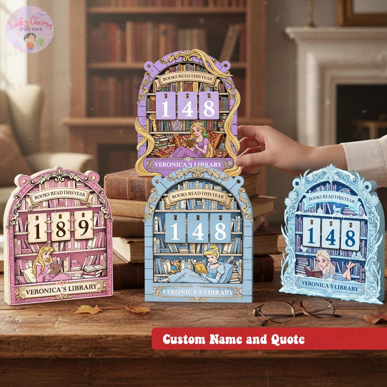 May include: Wooden book-themed reading trackers in pink, blue, and purple, each displaying a different number of books read. The trackers feature illustrations of Disney princesses and the text "BOOKS READ THIS YEAR" and "VERONICA'S LIBRARY".