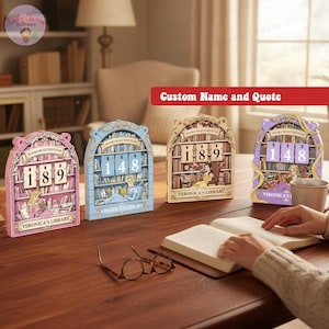 May include: Four decorative book-themed reading trackers in pink, blue, and gold tones, each displaying a different number. The trackers feature illustrations of characters reading, with the text "BOOKS READ THIS YEAR" and "VERONICA'S LIBRARY".