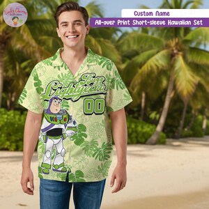 May include: A white ceramic mug with a black handle and the text "But First, Coffee" in a black, bold font. The mug is on a white surface.