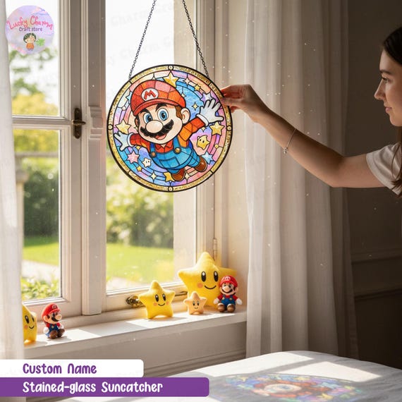 A custom-name stained-glass-style video game suncatcher that hangs in a window and throws coloured light — genuinely decorative, personalised, and something you'd never find at a mall.