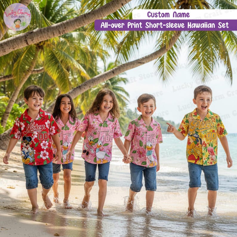 May include: Five children on a beach wearing matching short-sleeved Hawaiian shirts and denim shorts. The shirts are red, pink, and yellow, featuring cartoon characters and floral patterns. The text "Custom Name" and "All-over Print Short-sleeve Hawaiian Set" are visible.