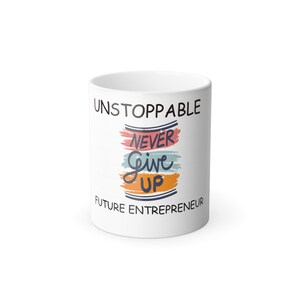 May include: White ceramic mug with the text "Unstoppable Never Give Up Future Entrepreneur" in black lettering. The text is stylized with colorful brushstrokes.