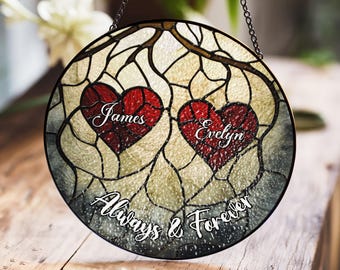 May include: A stained glass window hanging with two red hearts on a branch. The hearts have the names "James" and "Evelyn" inscribed on them. The text "Always & Forever" is written below the hearts.