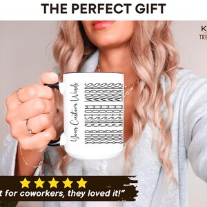 May include: White ceramic mug with a black rim and handle. The mug has black text that reads "Your Custom Words" and a pattern of the text repeated down the mug.