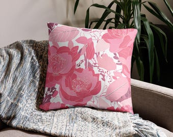 Almofada decorativa floral rosa com estampa botânica, estilo boho.
