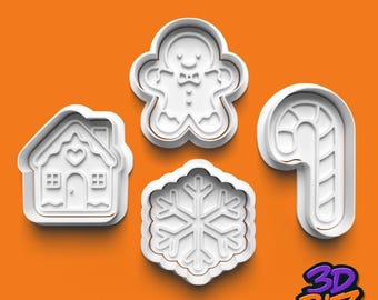 May include: Four white plastic cookie cutters in holiday shapes: a gingerbread man, a house, a snowflake, and a candy cane. The cutters have a brown outline and are set against an orange background. The logo "3D BITZ" is in the bottom right corner.